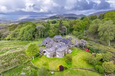 an aerial view of a house in a field at Coed-Stable in Dolgellau