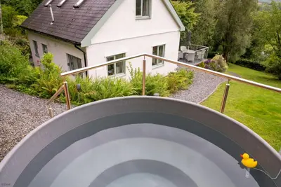a view of a house from the top of a stairway at Erw-Fair in Arthog