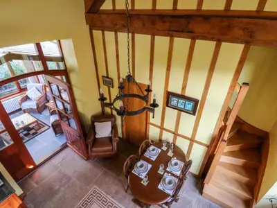 an overhead view of a living room with a staircase at Maggie's Barn in Brecon