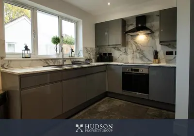 a kitchen with a sink and a stove at Modern 5 Bedroom Home in Shrewsbury in Shrewsbury