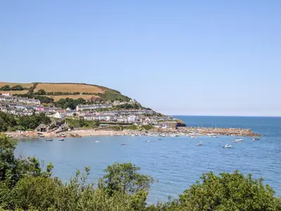 a view of a beach with boats in the water at Zenobia in New Quay