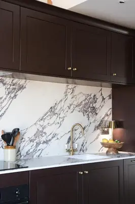 a kitchen with a sink and a marble wall at Luxury Apartment in Shropshire sleeps 4 in Shrewsbury