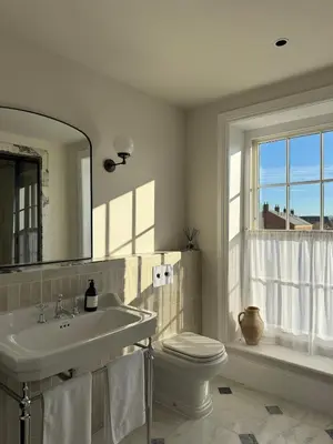 a bathroom with a sink and a toilet and a mirror at Luxury Apartment in Shropshire sleeps 4 in Shrewsbury