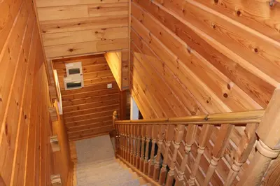 an overhead view of a wooden staircase in a cabin at Luxurious lodge near Barmouth in Dyffryn