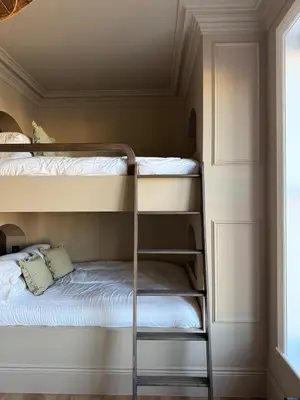 a bunk bed room with two bunk beds and a ladder at Luxury Apartment in Shropshire sleeps 6 in Shrewsbury