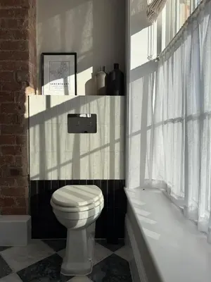 a bathroom with a white toilet and a bath tub at Luxury Apartment in Shropshire sleeps 6 in Shrewsbury