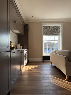 a kitchen with a couch and a large window at Luxury Apartment in Shropshire sleeps 6 in Shrewsbury