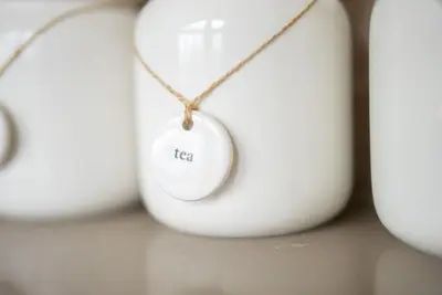 a white object with a necklace on a table at Llety-Hiraeth in Montgomery
