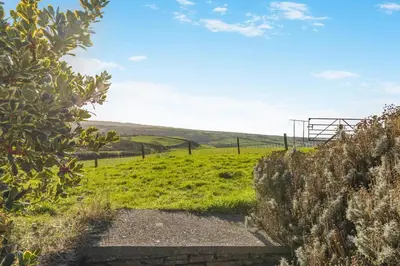 a path leading to a field with a fence at 3 Bed in Rhydyfelin oc-c34178 in Rhyd-y-felin