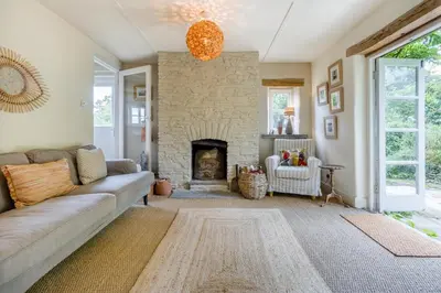 a living room with a couch and a stone fireplace at 3 Bed in Newton St. Margarets oc-o33367 in Saint Margaret