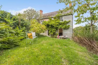 an old house with a chair in the yard at 3 Bed in Newton St. Margarets oc-o33367 in Saint Margaret