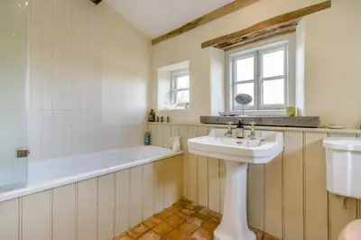 a bathroom with a sink and a bath tub at 3 Bed in Newton St. Margarets oc-o33367 in Saint Margaret