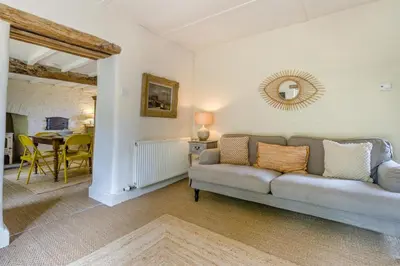 a living room with a couch and a table at 3 Bed in Newton St. Margarets oc-o33367 in Saint Margaret