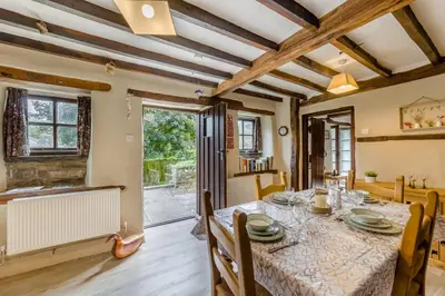 a kitchen and dining room with a table and chairs at 2 Bed in Llandefalle oc-n32991 in Llandefalle