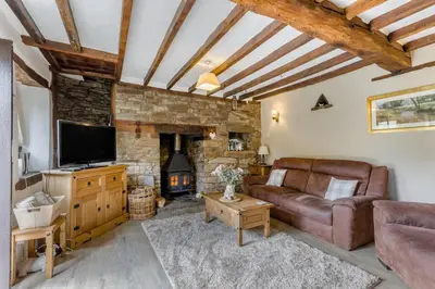 a living room with a couch and a fireplace at 2 Bed in Llandefalle oc-n32991 in Llandefalle