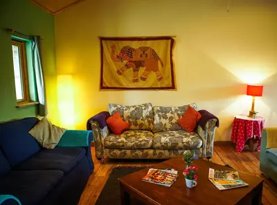 a living room with a couch and a table at Naturesbase Lodge in Cilcennin