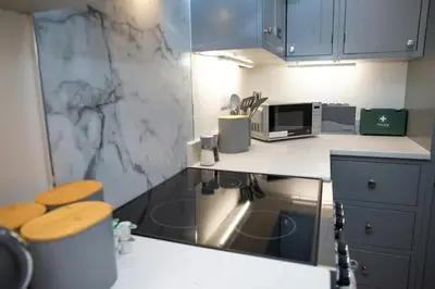 a kitchen with a counter top with a microwave at Dolphin View New Quay in New Quay