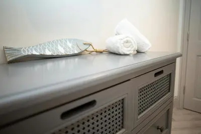 a counter with towels on top of it at Bay View New Quay in New Quay