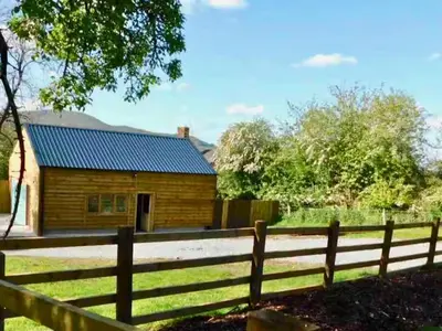a wooden fence in front of a house at Bryn Gwyn - Ukc7801 in Shrewsbury