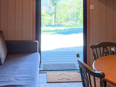 a door to a porch with a table and a couch at The Orchard - Ukc7804 in Shrewsbury