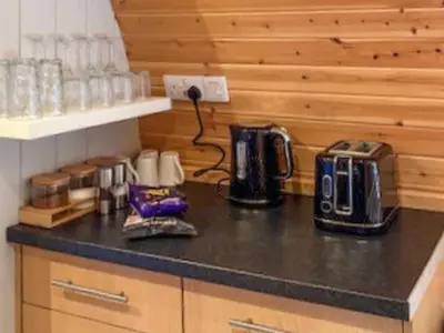 a kitchen counter with a coffee maker on a counter top at The Orchard - Ukc7804 in Shrewsbury