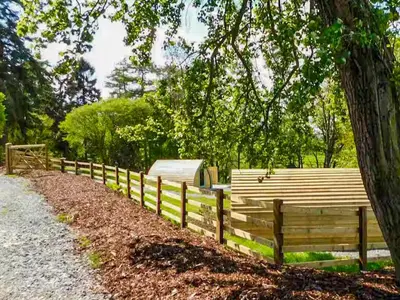 a wooden fence in front of a tree at The Orchard - Ukc7804 in Shrewsbury