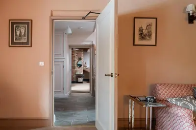 a hallway with a door leading into a room at Wyvern House in Alberbury
