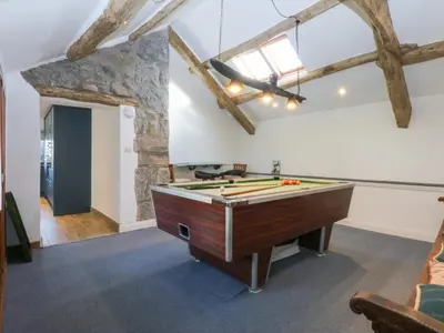 a large room with a pool table in it at Yr Hen Felin in Dyffryn
