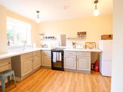 a kitchen with white cabinets and a black stove top oven at 2 Horseshoe Road in Montgomery