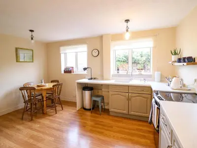 a kitchen with a sink and a table in it at 2 Horseshoe Road in Montgomery