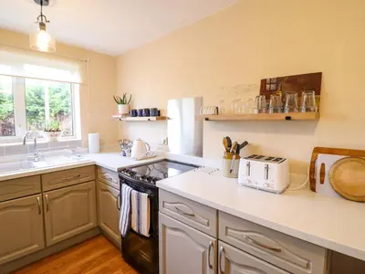 a kitchen with a sink and a stove top oven at 2 Horseshoe Road in Montgomery