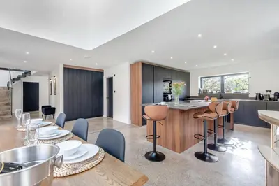 a kitchen and living room with a table and chairs at 3 Bed in Leominster oc-w34380 in Leominster