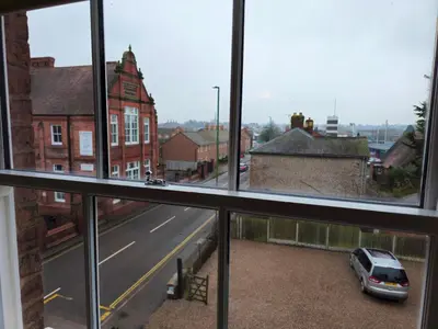 a view of a street from a window with a car at Stylish and newly renovated penthouse apartment - Pass the Keys in Shrewsbury