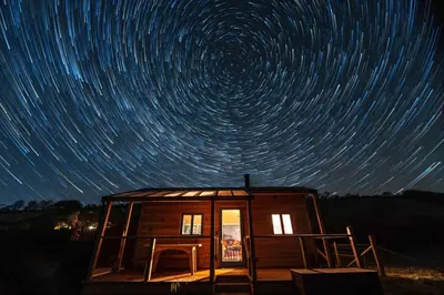 a cabin with star trails in the night sky at 1 Bed in Llanfihangel-y-Creuddyn oc-c34624 in Llanfihangel-y-creuddyn