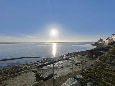 a view of the ocean with the sun in the sky at 3 Bed in Aberdovey oc-c33725 in Aberdyfi