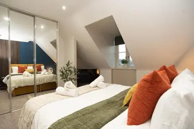 a bedroom with two beds with towels at Professionals welcome - Near Town Centre - Free Parking-Sleeps 4 in Shrewsbury