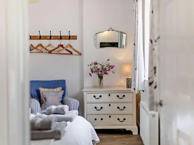 a bedroom with a bed and a dresser and a mirror at 1 Bed in Leominster oc-78638 in Stoke Prior