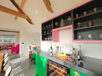 a kitchen with a green and black counter top at 7 Bed in Welshpool oc-96412 in Berriew
