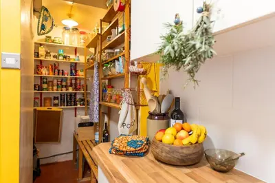 a kitchen counter with a bowl of fruit on it at Spacious 4 bed home to sleep 9, parking for 4 cars in Shrewsbury