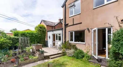 a house with a garden in front of it at Spacious 4 bed home to sleep 9, parking for 4 cars in Shrewsbury