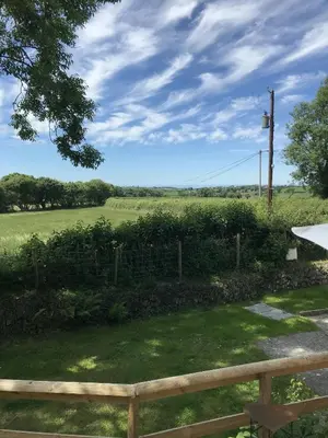 a view of a field with a fence at Sgubor Delyn Aberystwyth in Llanrhystyd