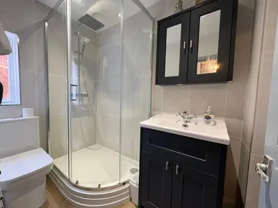 a bathroom with a shower and a sink and a toilet at Charming 2 Bed House in Central Shrewsbury in Shrewsbury