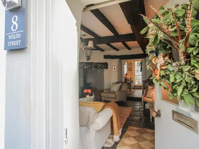 a living room with a couch and a table at 8 Welsh Street in Bishops Castle