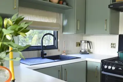 a kitchen with a sink and a window at Lavender Lodge