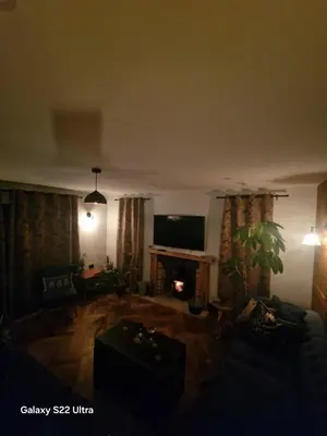 a living room with a couch and a fireplace at Luxurious 5-Bedroom House Rental with Scenic Countryside Views in Hereford