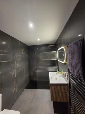 a bathroom with a toilet and a sink at Luxurious 5-Bedroom House Rental with Scenic Countryside Views in Hereford