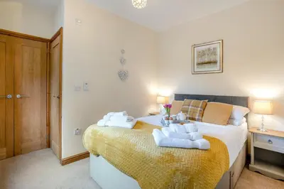 a bedroom with a bed with towels on it at 2 Bed in Brecon oc-r33603 in Lower Chapel