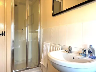 a bathroom with a sink and a shower at 2 bedroom house 12mins walk to town in Shrewsbury