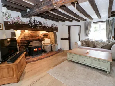 a living room with a couch and a fireplace at The Old Shop in Builth Wells