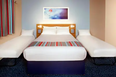 a pair of beds in a hotel room at Travelodge Ludlow in Ludlow